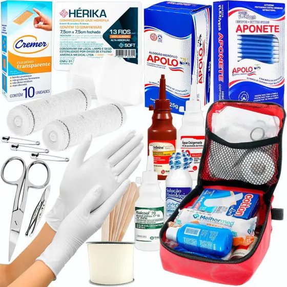 Kit de primeiros socorros completo com curativos, gazes, algodão, antissépticos e acessórios médicos organizados em bolsa vermelha.