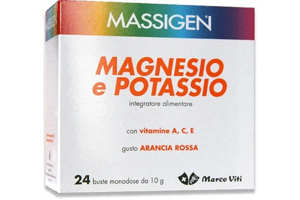 Caixa de suplemento alimentar Massigen Magnésio e Potássio, embalagem branca com faixa colorida no topo e informações sobre vitaminas e sabor laranja sanguínea.